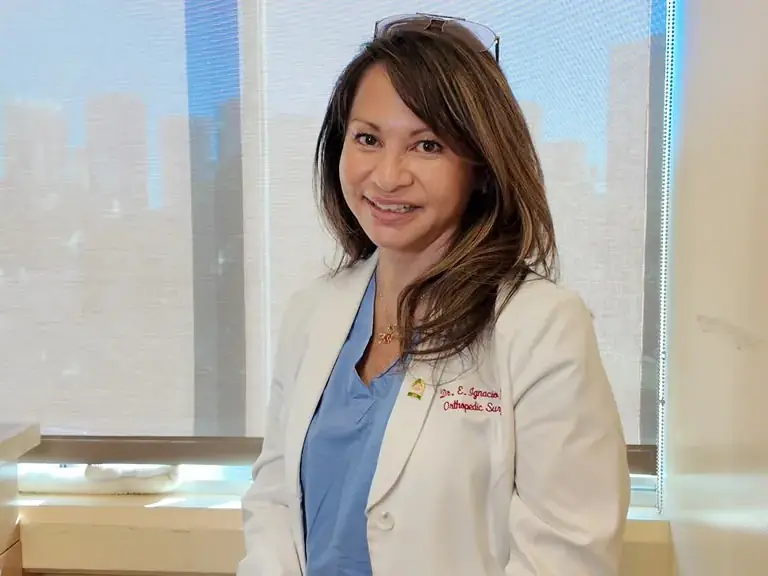 Dr. Elizabeth Ignacio, MD in her white coat